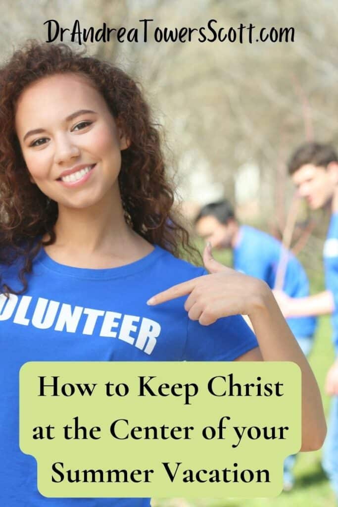 woman in a group wearing a blue shirt that says 'volunteer' in white. Article title at the bottom - 'how to keep Christ at the center of your summer vacation' and author website at the top - dr andrea towers scott dot com